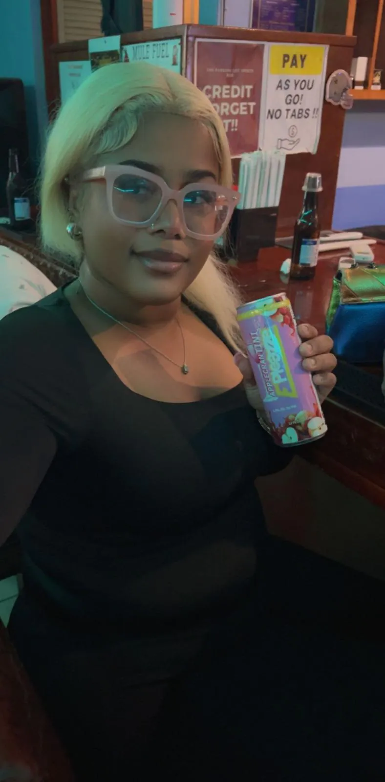 Woman at a bar with an ePleazze can