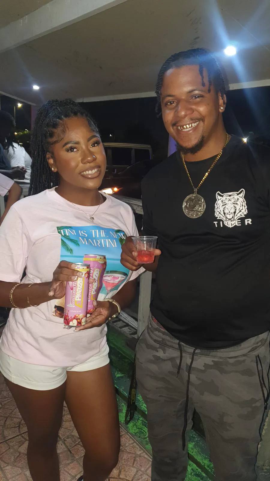 Couple holding ePleazze can at a party