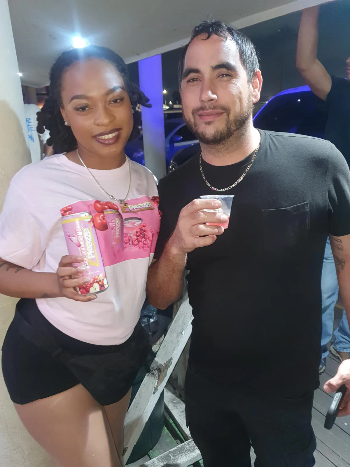 Couple toasting with ePleazze cans